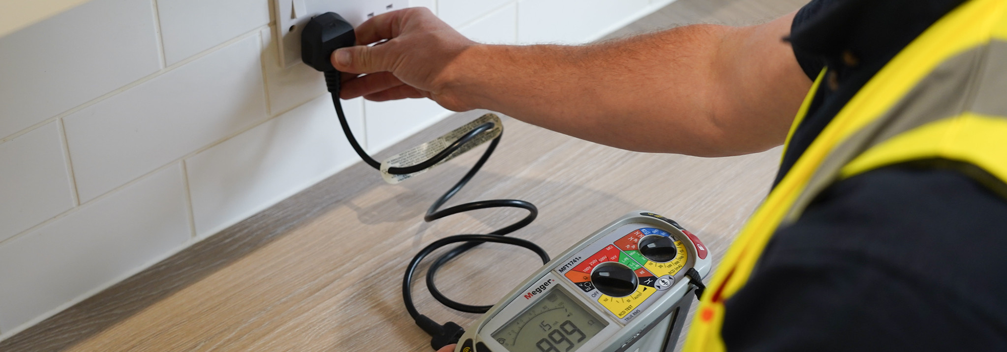 operative in high vis testing an electrical outlet
